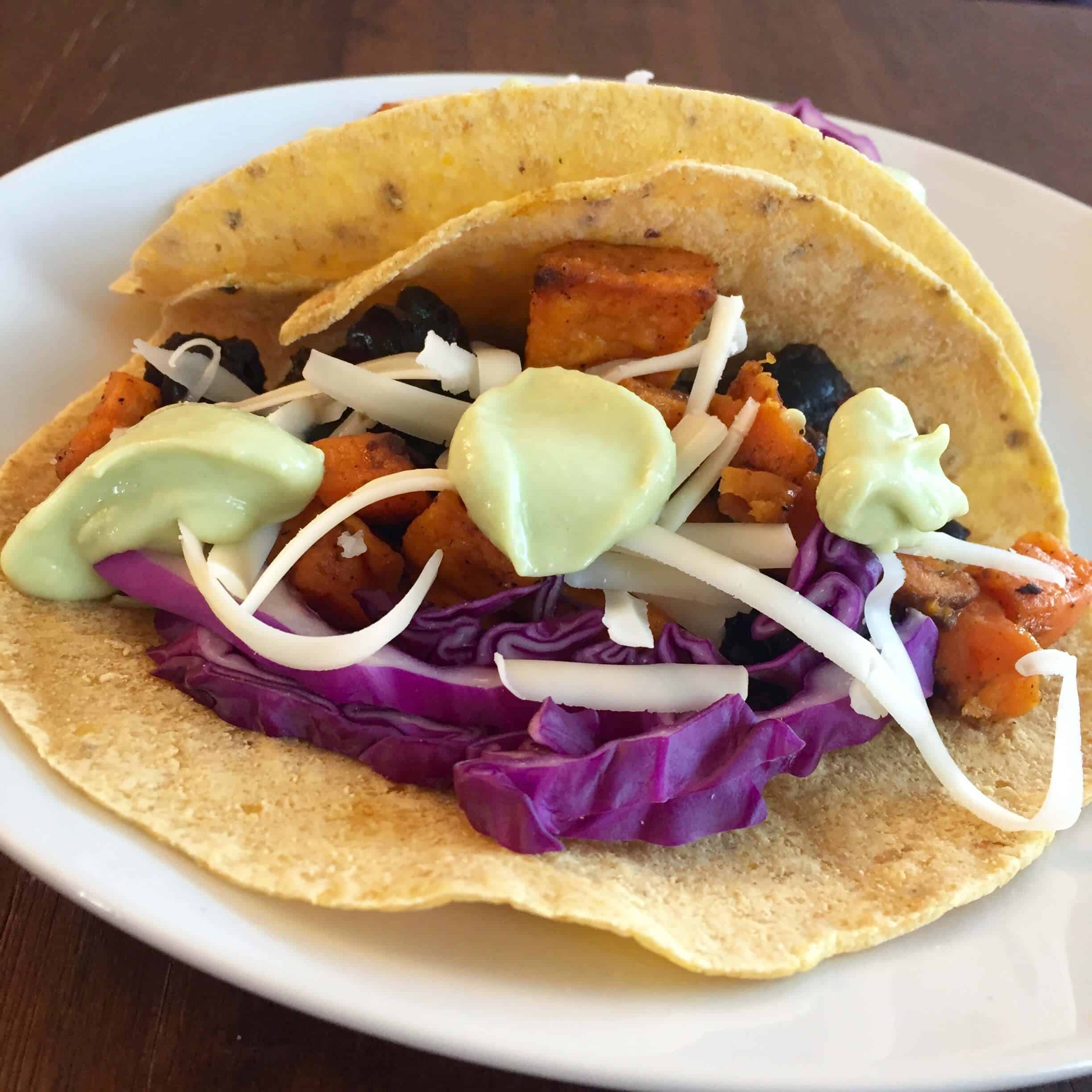 black-bean-and-sweet-potato-tacos-with-avocado-crema-the-scramble