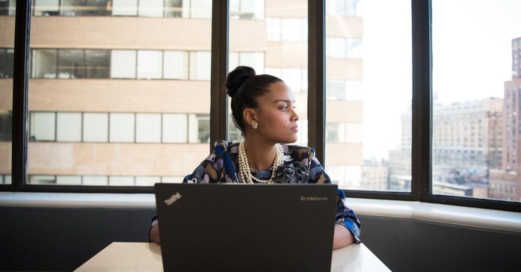 woman working on a laptop: Managing Mid-Career Frustrations