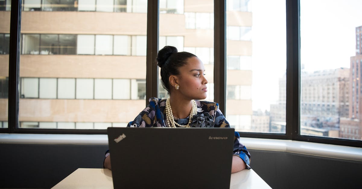 Confident woman working on a laptop: Managing Mid-Career Frustrations