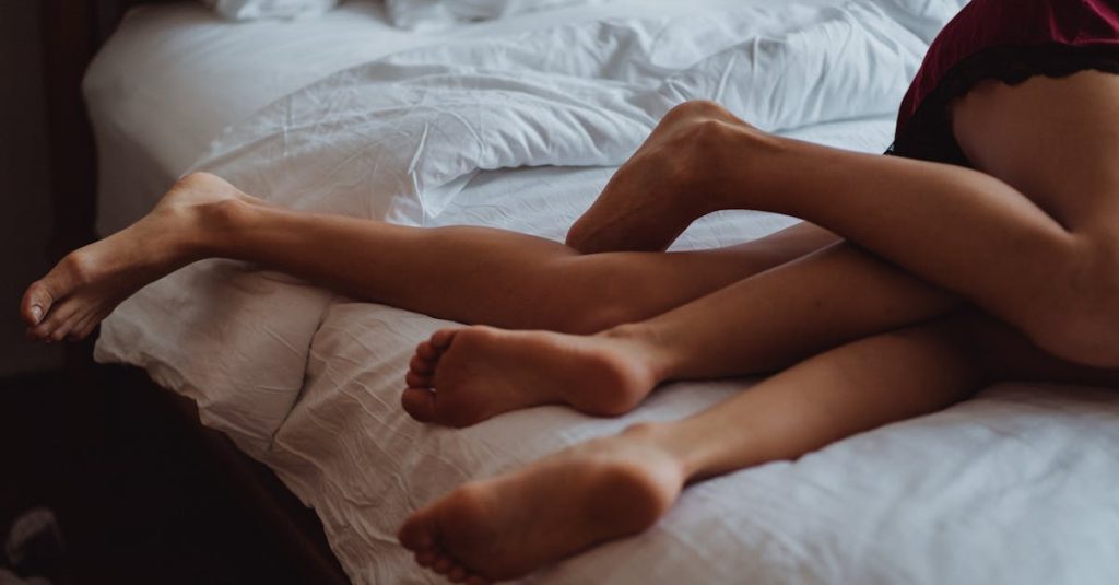 intertwined legs on a bed: is losing your libido during perimenopause normal?